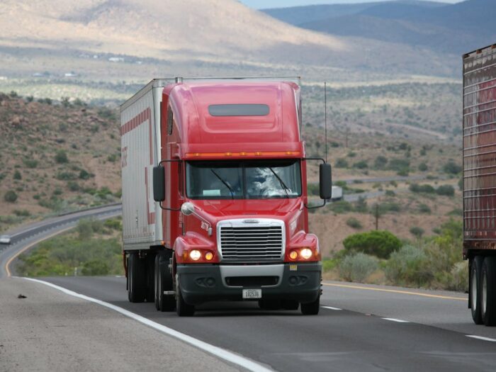 Photo by CARLOSCRUZ ARTEGRAFIA: https://www.pexels.com/photo/red-truck-on-the-road-11087837/
