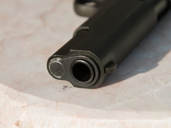 Photo by Somchai Kongkamsri: https://www.pexels.com/photo/black-metal-gun-on-white-surface-34552/