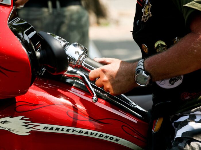 Photo by Image Hunter: https://www.pexels.com/photo/a-person-riding-a-red-motorcycle-13023840/